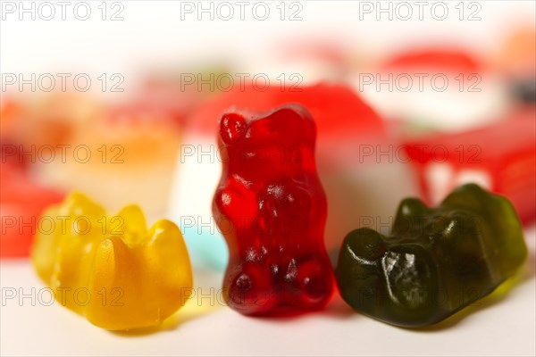 Close-up of colorful jelly bears on a white background