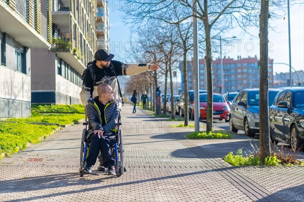 A disabled person walking with a friend in a wheelchair on the street