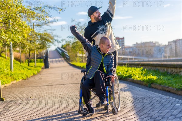 Disabled person in wheelchair with friend overjoyed