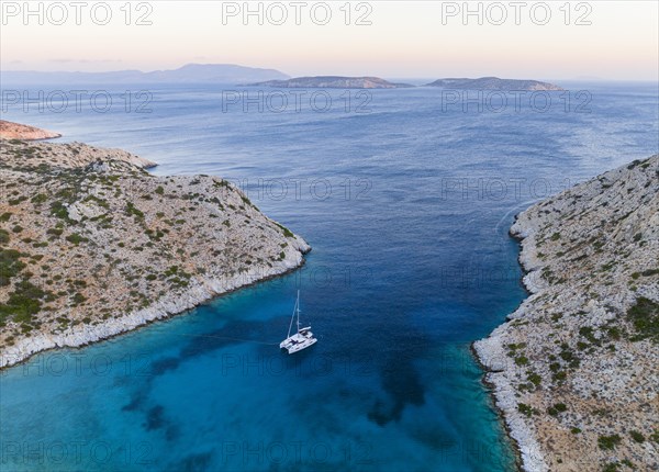 Sailing catamaran in a bay of Levitha Island