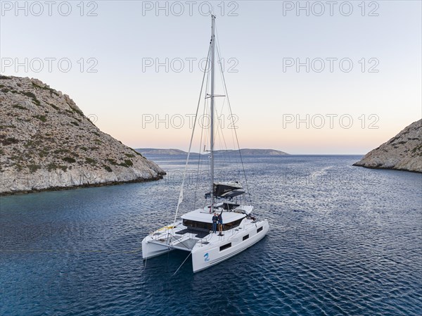 Sailing catamaran in a bay of Levitha Island