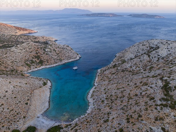 Sailing catamaran in a bay of Levitha Island