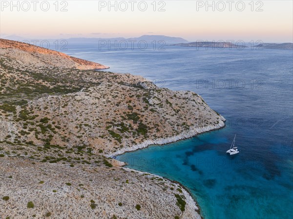 Sailing catamaran in a bay of Levitha Island