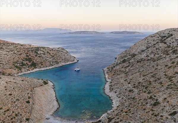 Sailing catamaran in a bay of Levitha Island