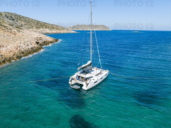 Sailing catamaran with shore lines