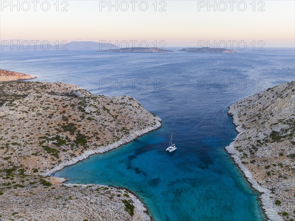 Sailing catamaran in a bay of Levitha Island