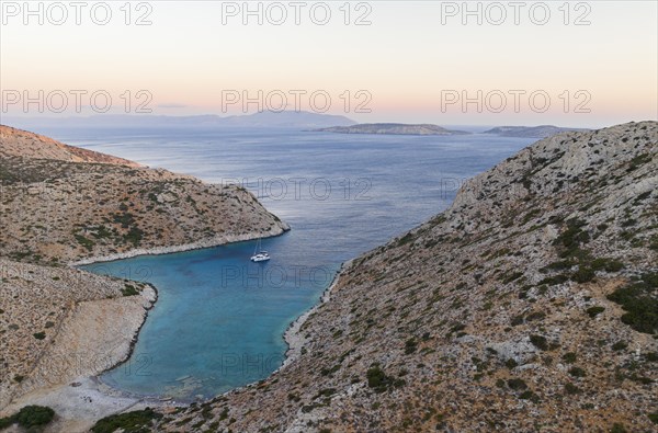 Sailing catamaran in a bay of Levitha Island