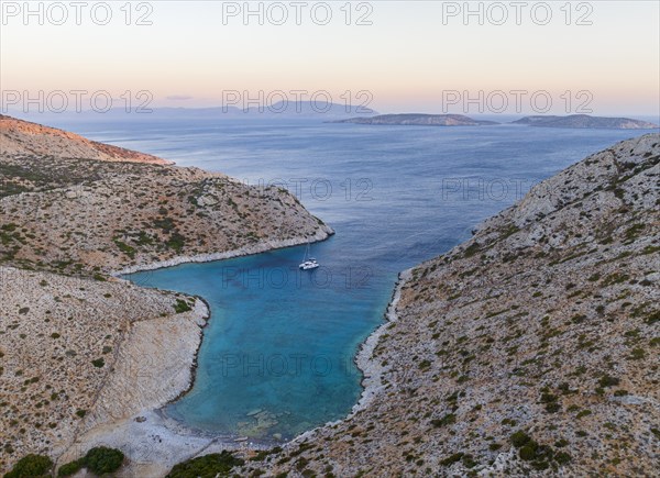 Sailing catamaran in a bay of Levitha Island