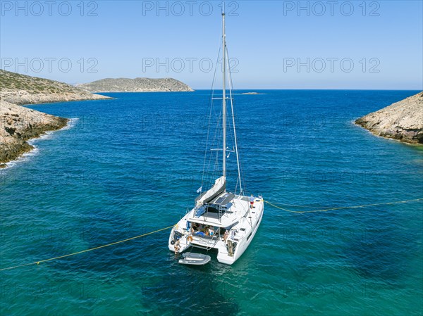 Sailing catamaran with shore lines