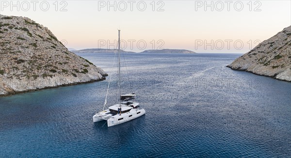 Sailing catamaran in a bay of Levitha Island