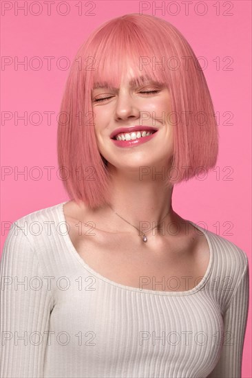 Beautiful funny cute woman in pink wig and classic makeup