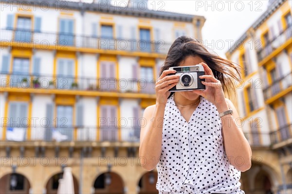 Tourist woman enjoying visiting the city looking at travel photos
