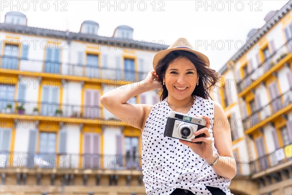 Tourist woman visiting the city looking at travel photos