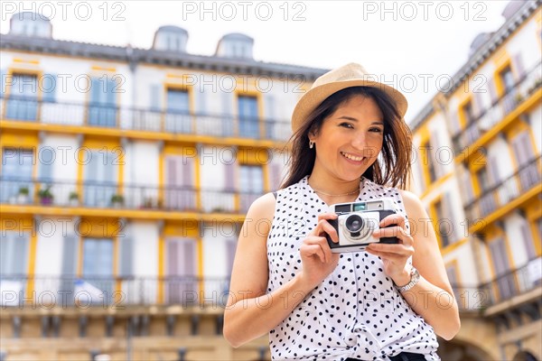 Tourist woman enjoying visiting the city looking at travel photos