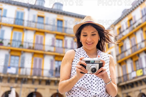 Tourist woman visiting the city looking at travel photos