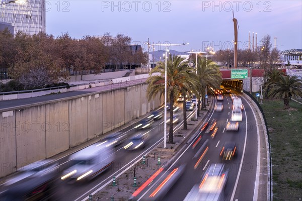 Dense traffic on Ronda de Mar avenue at sunset in the city of Barcelona in Catalonia Spain