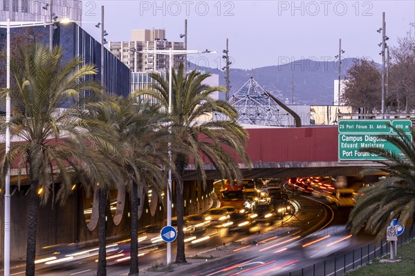 Dense traffic on Ronda de Mar avenue at sunset in the city of Barcelona in Catalonia Spain