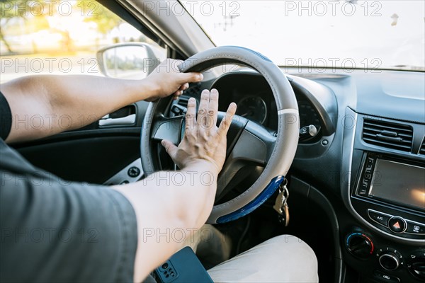 Driver man honking car horn