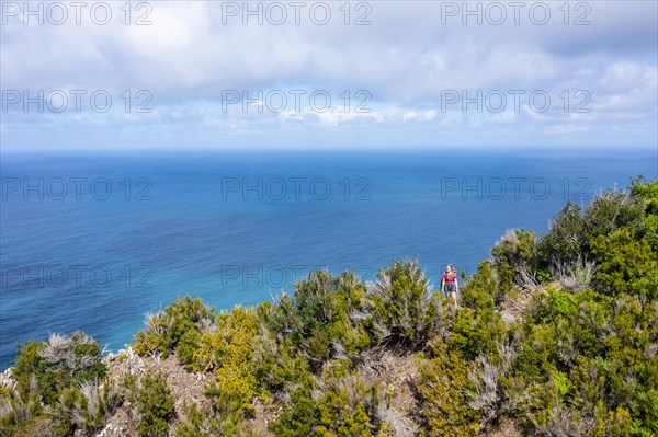 Hiker in front of the sea