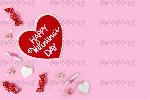 Valentine's Day flat lay with heart with text 'Happy Valentine's Day'