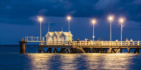 Anglers on a jetty in Arcachon in the evening