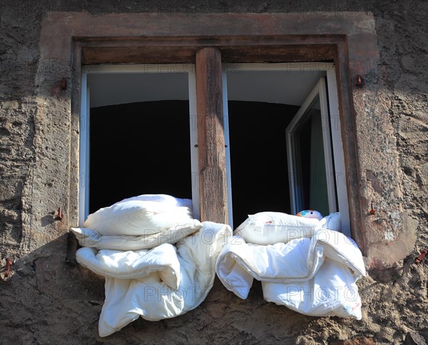 Bed linen is for airing in the open window