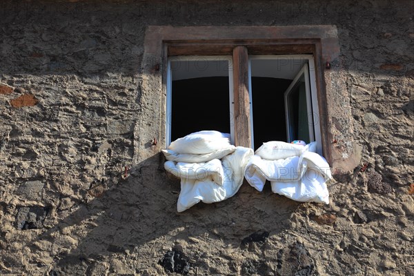 Bed linen is for airing in the open window