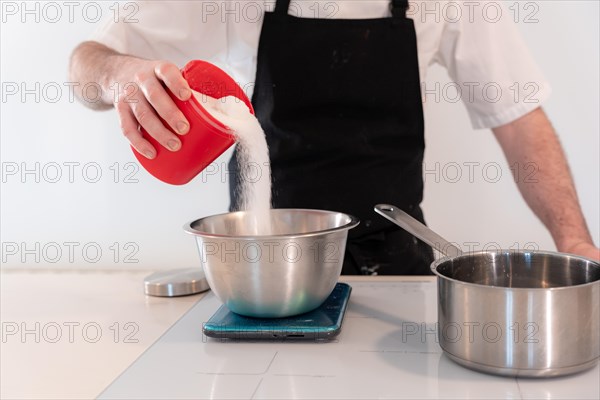 Hands of a man cooking a red velvet cake at home