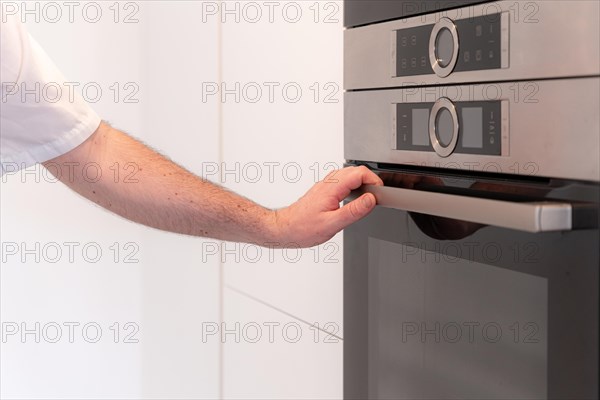 A man baker cooking a red velvet cake at home