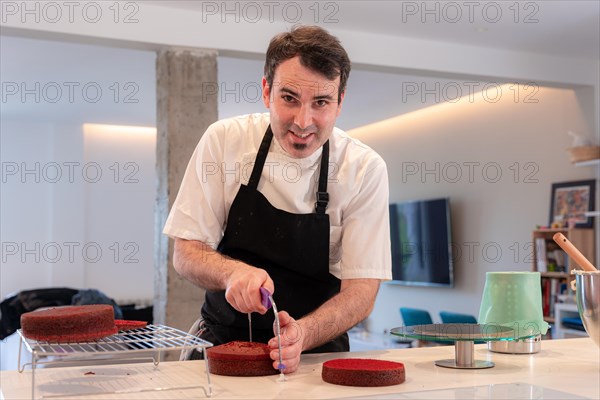 A challenger man bakes a red velvet cake at home