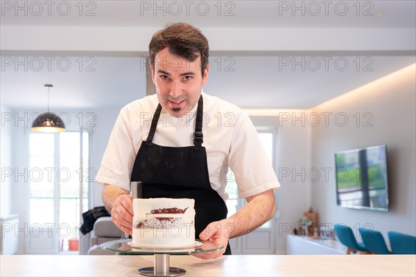 A challenger man bakes a red velvet cake at home