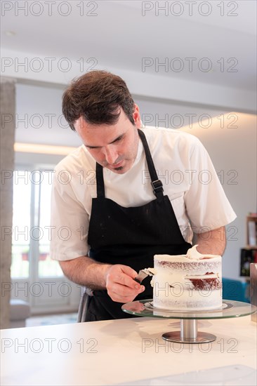 A challenger man bakes a red velvet cake at home