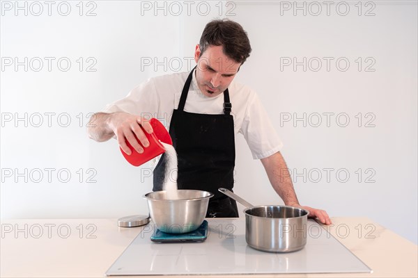 Hands of a man cooking a red velvet cake at home