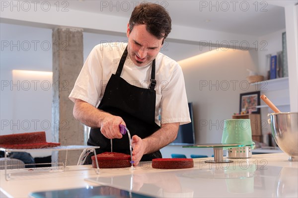 A challenger man bakes a red velvet cake at home