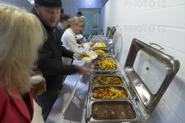 Guests at the Persian buffet at a party