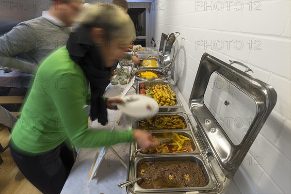 Guests at the Persian buffet at a party