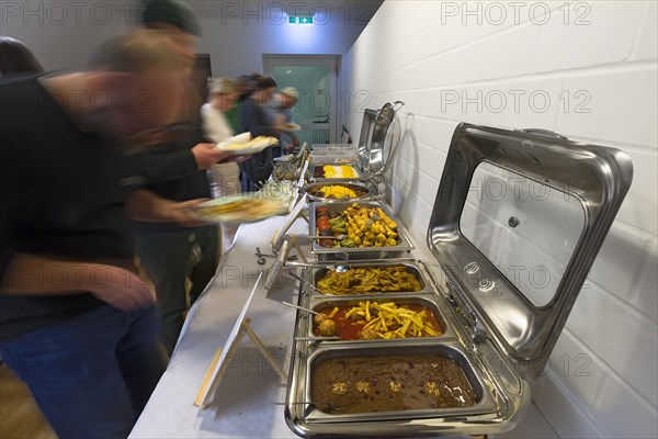 Guests at the Persian buffet at a party