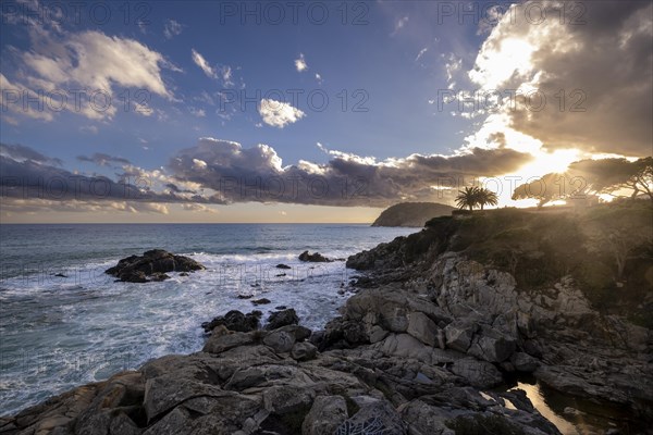 Landscape of stones and sea on the Costa Brava in Girona in Spain at sunset on a winter afternoon