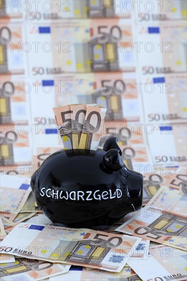 Piggy bank for black money and 50 euro banknotes