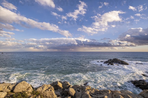 Landscape of stones and sea on the Costa Brava in Girona in Spain at sunset on a winter afternoon