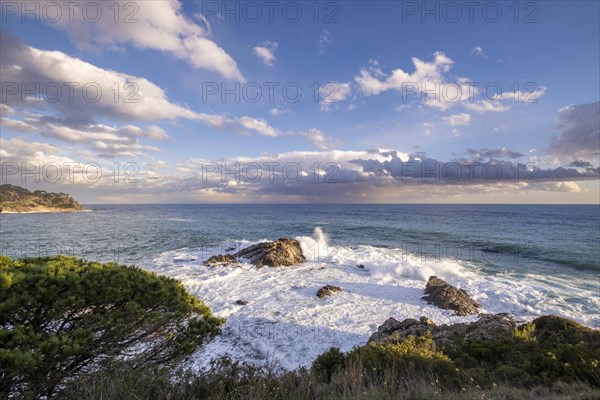 Landscape of stones and sea on the Costa Brava in Girona in Spain at sunset on a winter afternoon