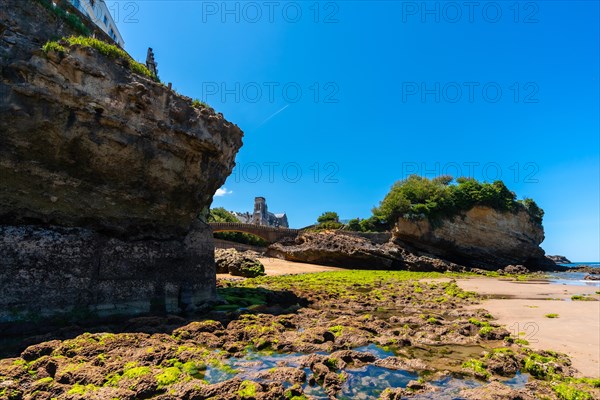 Low tide on the beach under the Basta Rock of Biarritz beach