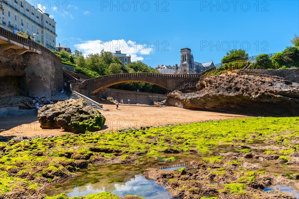 Low tide at the Roca de Basta bridge on Biarritz beach