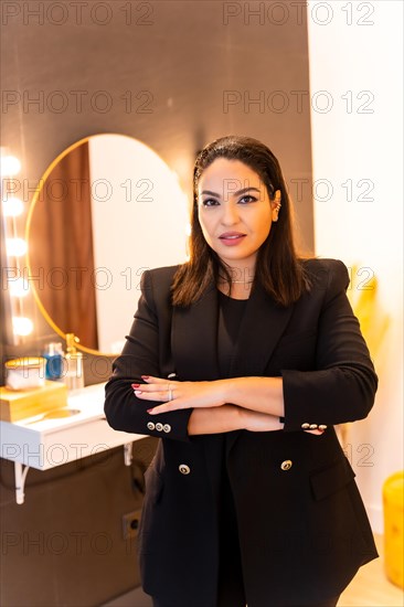 Woman of Latin ethnicity in an aesthetic store of eyebrows and nails