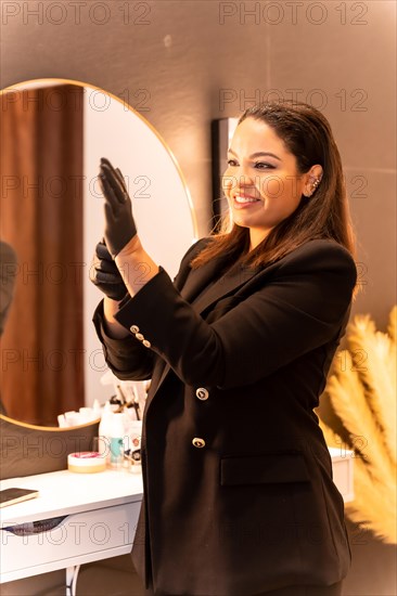 Woman of Latin ethnicity in an aesthetic store of eyebrows and nails