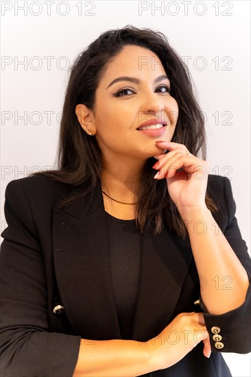 Woman of Latin ethnicity in an aesthetic store of eyebrows and nails