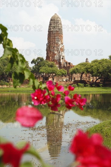 Prang of Wat Phra Ram reflected in the park lake