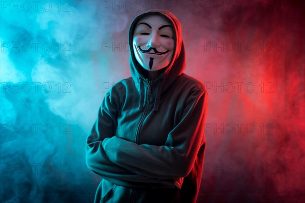 Hacker with anonymous mask with arms crossed with a menacing look