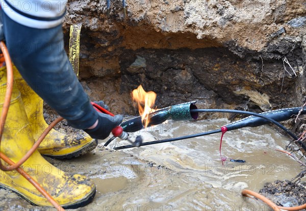 Worker repairs a telephone line