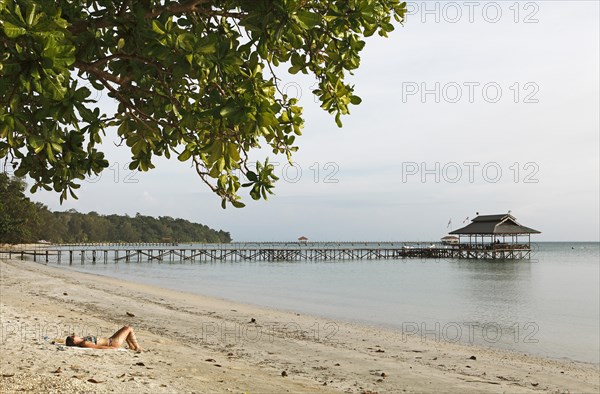 Beach and jetty on Pulau Tiga Island or Survivor Island